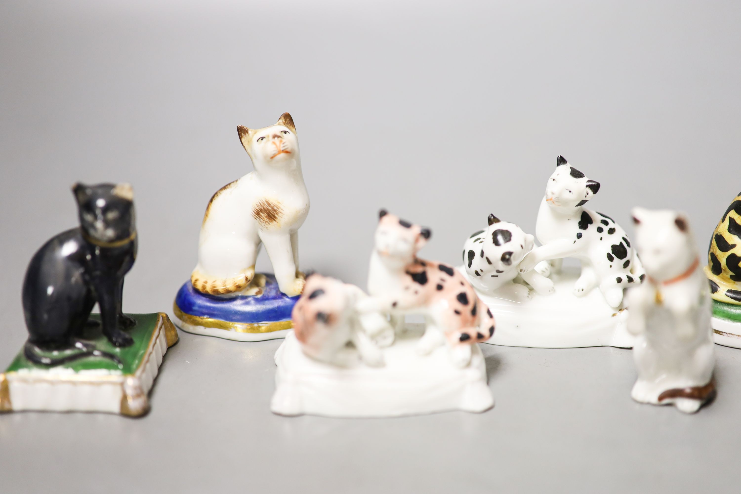 Six French porcelain cat figures or groups, and a similar sheep figure, late 19th century